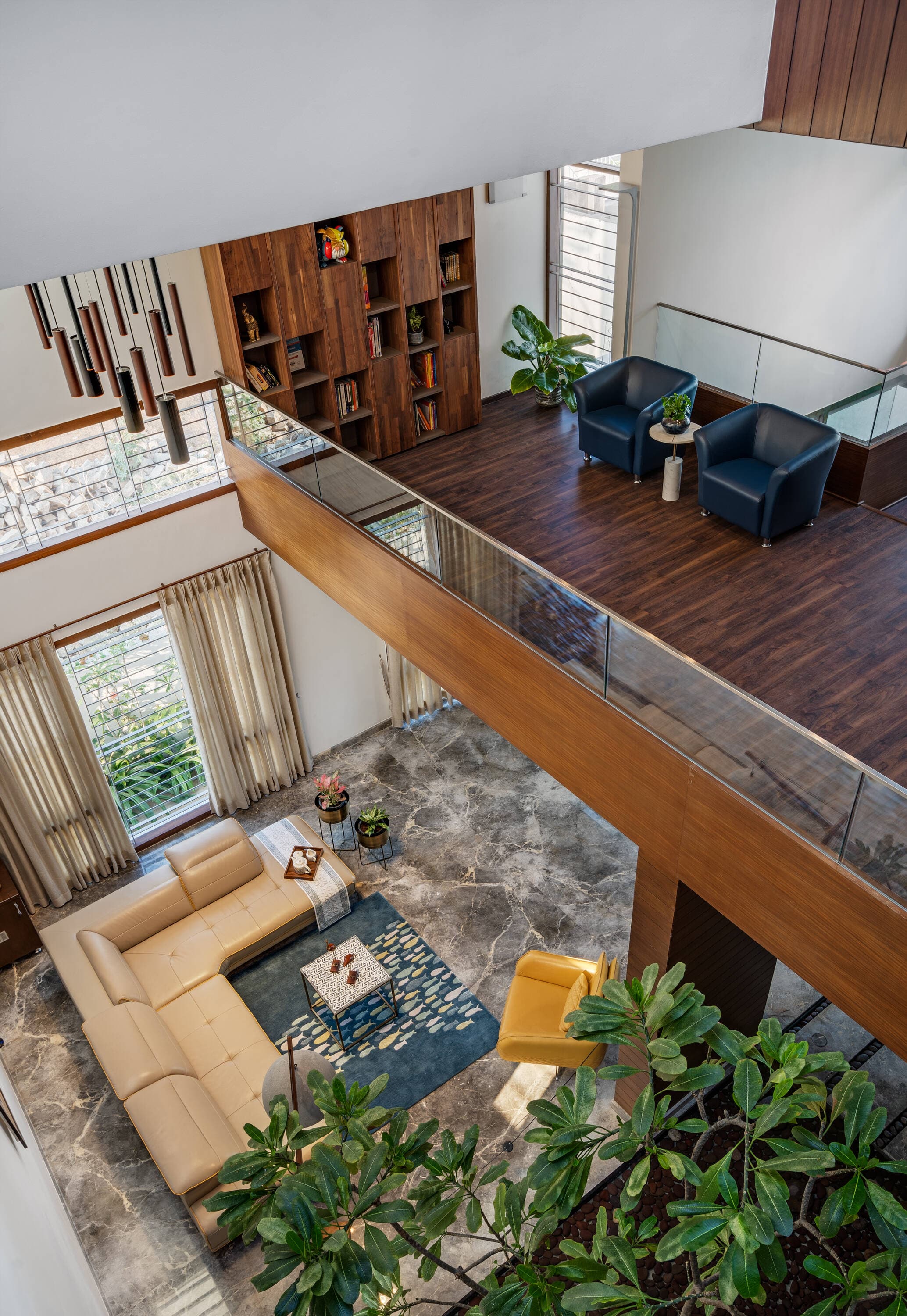 Mezzanine perspective looking across the illuminated double-height spatial volume