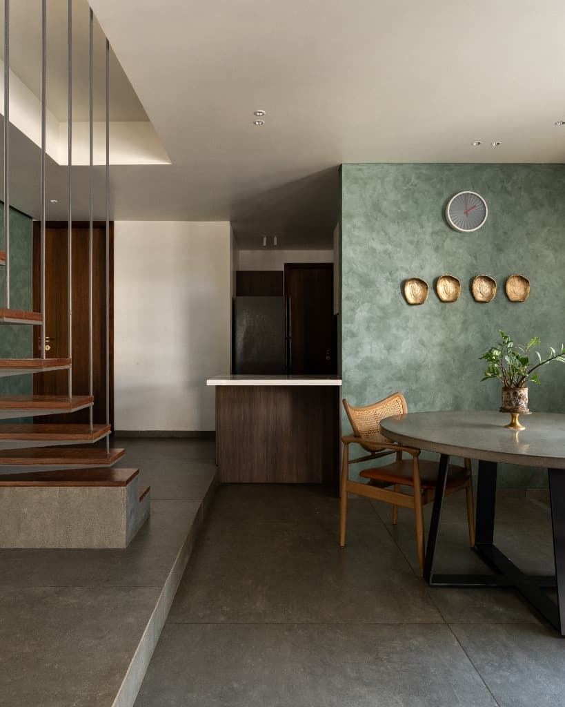 Dining Setting & Sage Plaster Accent Wall