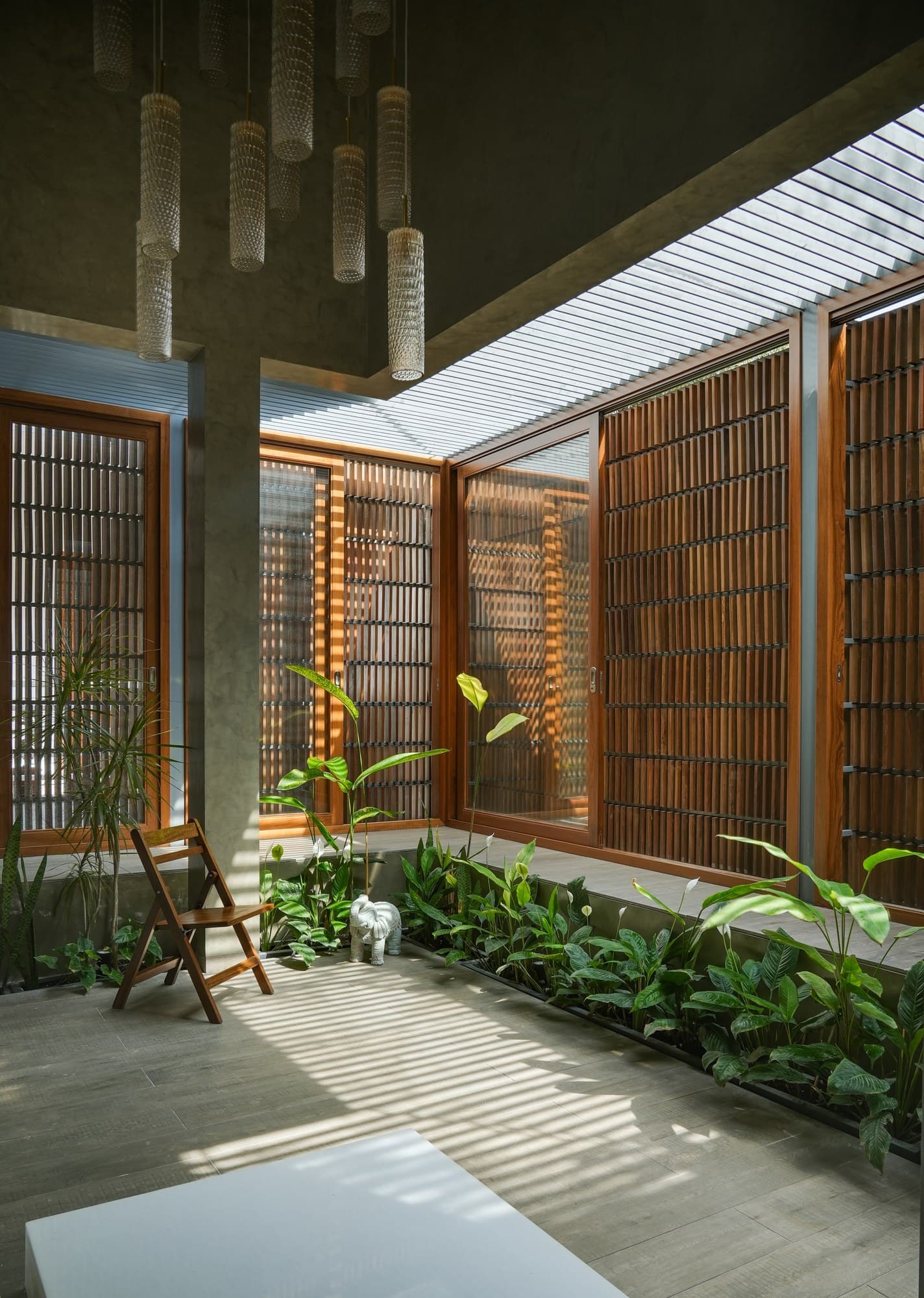 Arrival entrance alcove with yellow accent portal and serene sculpture