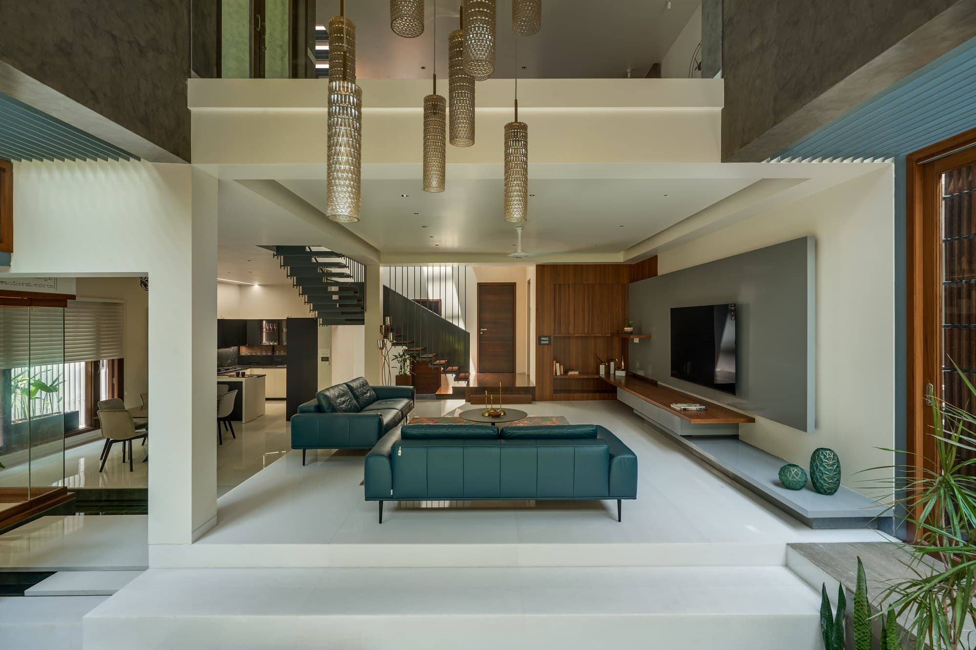 Living area looking out towards internal court garden and floor-to-ceiling glass