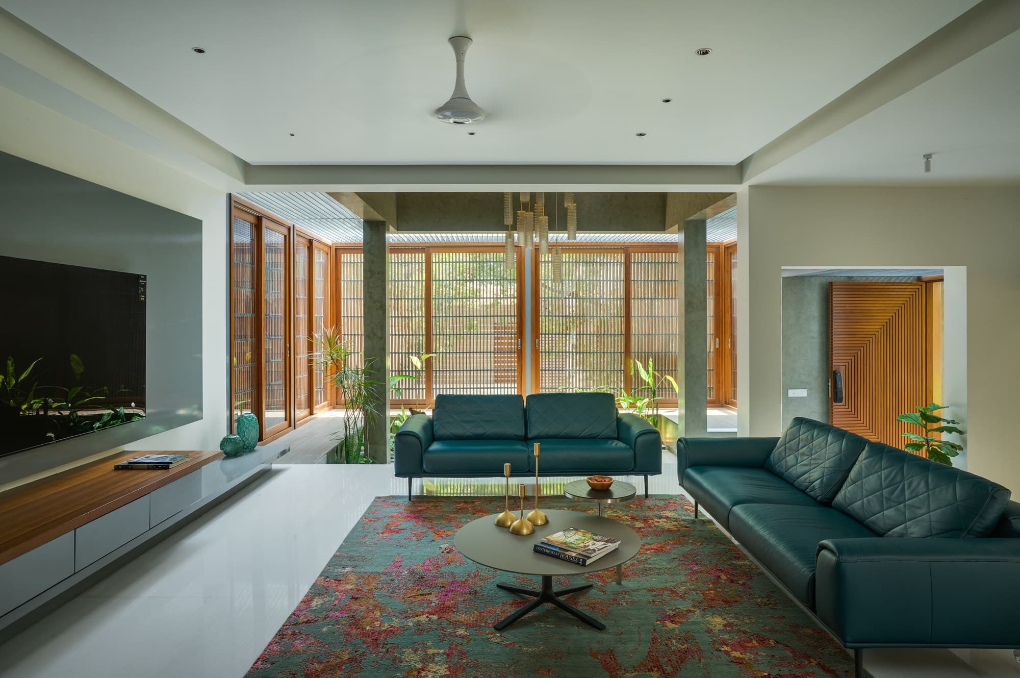 Formal seating area framed by marble tables and courtyard backdrop