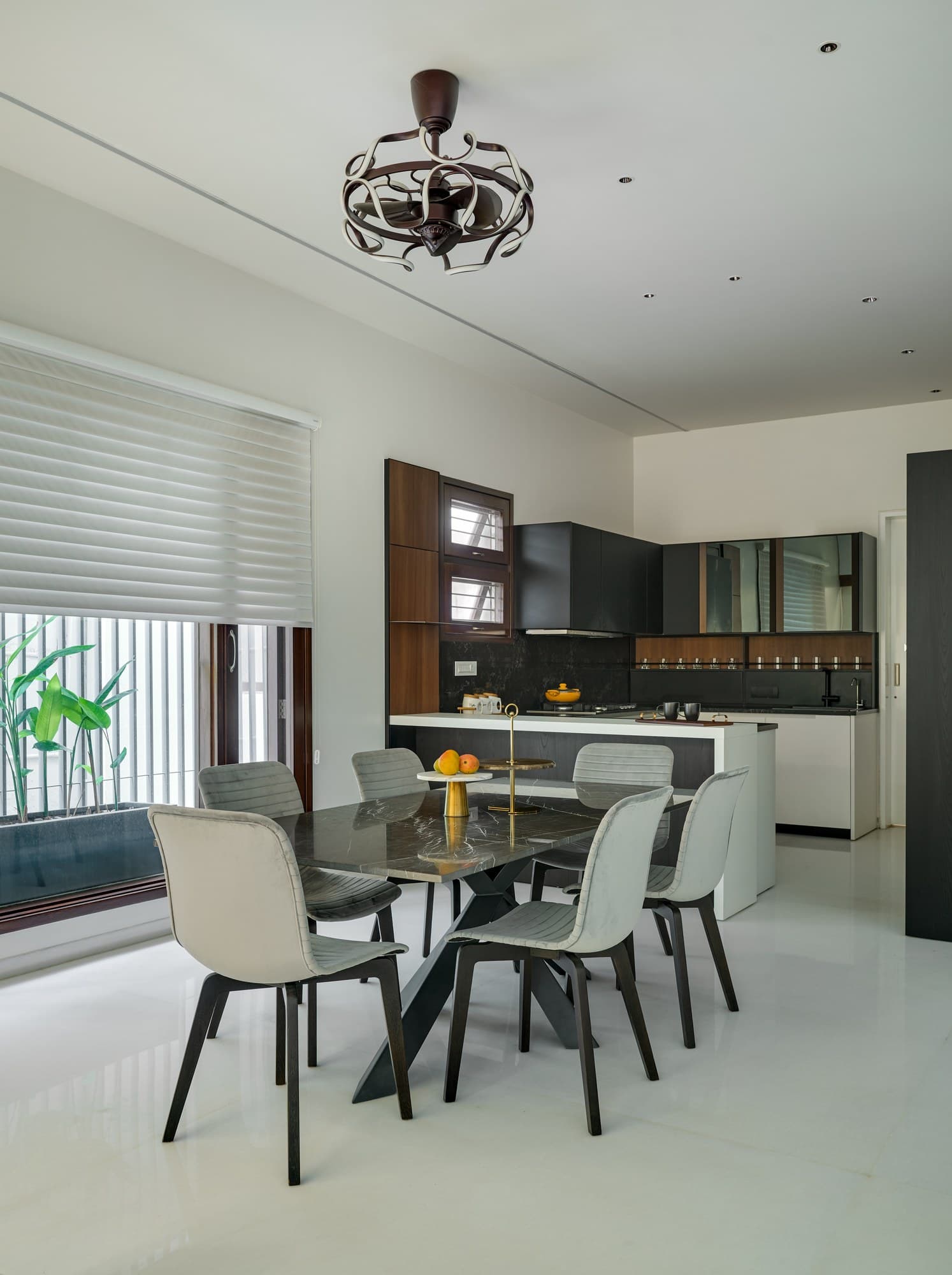 Open dining pavilion with Italian marble dining table and pendant light