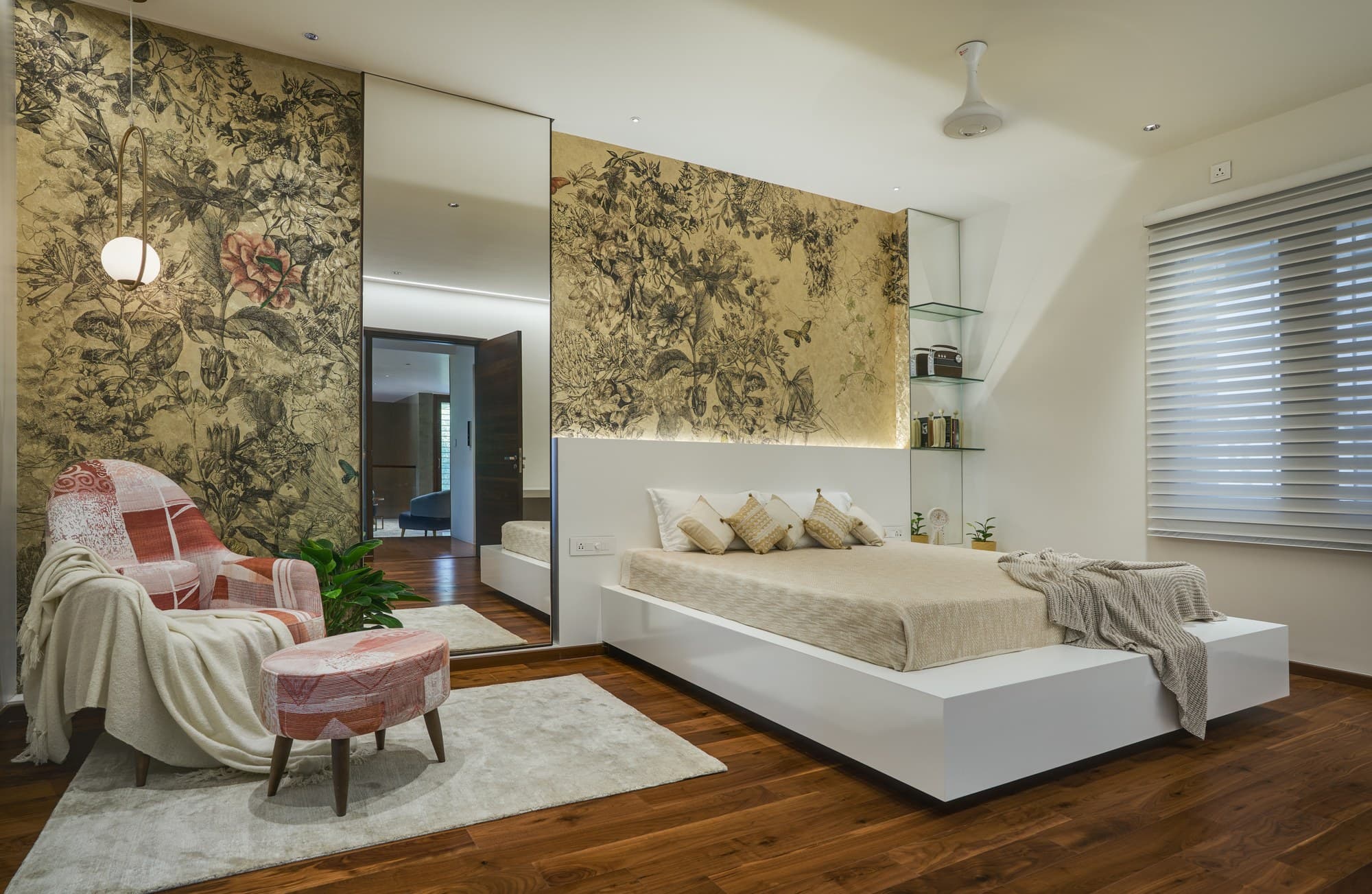 Master suite with bespoke botanical accent wall and low platform bed