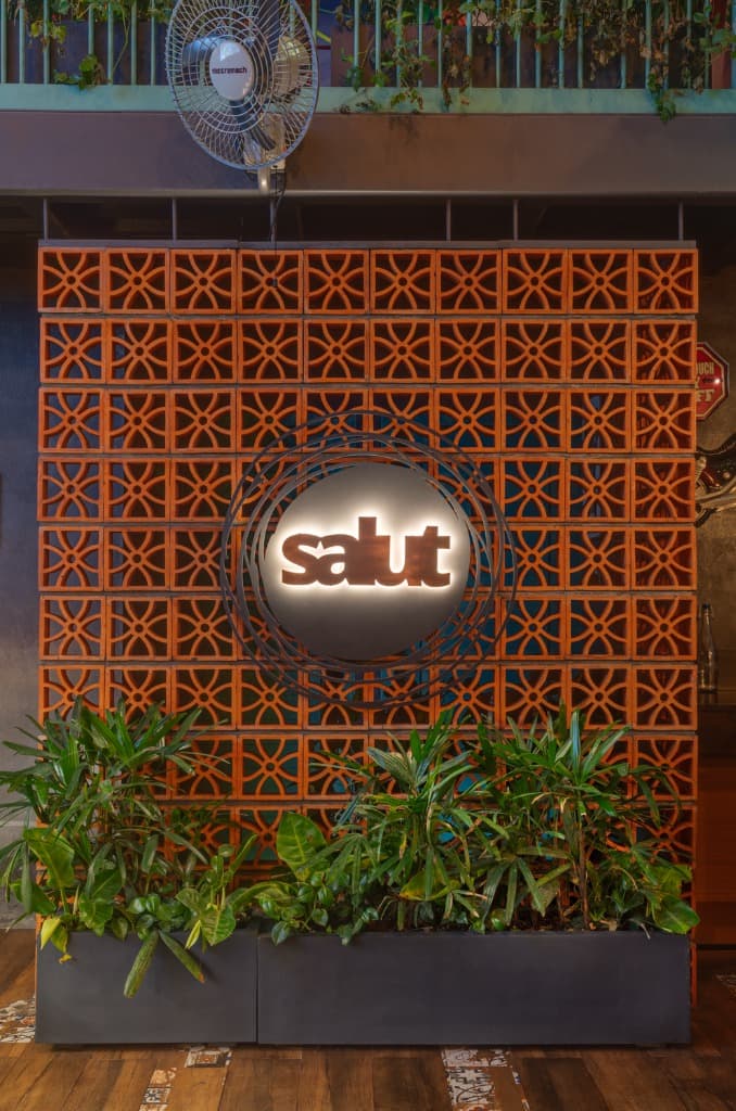 Terracotta Breeze-Block Screen & Salut Emblem